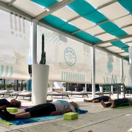 Morning yoga at a renowned lido in front of Lake Garda 0