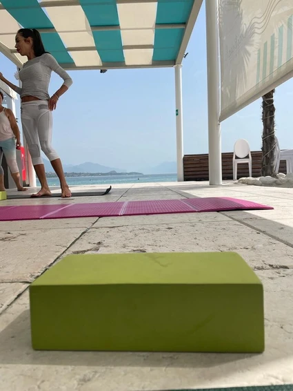 Morning yoga at a renowned lido in front of Lake Garda 3