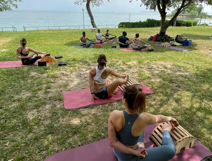 Yoga group lesson outdoors with a view on Lake Garda 11