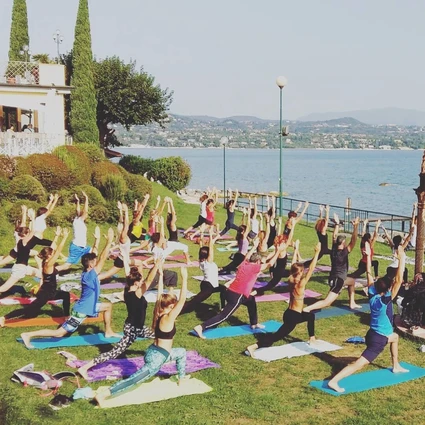 Yoga group lesson outdoors with a view on Lake Garda 16