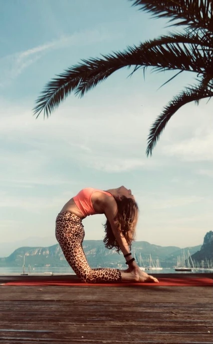 Group yoga lesson at dawn on terrace facing Lake Garda in Bardolino 4